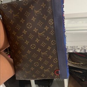 Louis Vuitton Monogram Brown and Blue Toiletry Bag
Women’s Clutch